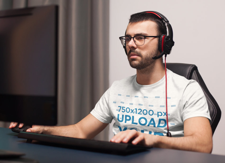 T-Shirt Mockup Featuring a Developer Using a Computer