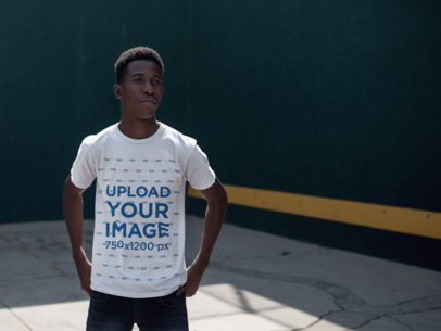 Mockup of a Young Man Wearing a Round Neck Tshirt While At The Fronton Court