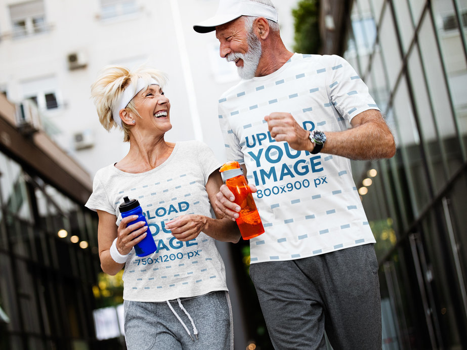 T-Shirt Mockup of a Senior Woman Jogging With Her Husband in the City 