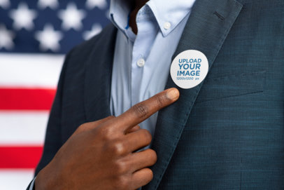 Mockup of a Suited Man Pointing to His Political Campaign Sticker