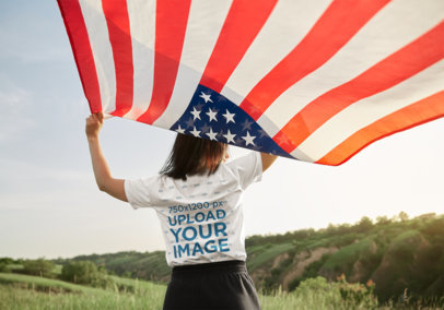 Back-View Tee Mockup of a Woman Holding an American Flag 
