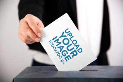 Mockup of a Man Putting a Horizontal Flyer into a Ballot Box 