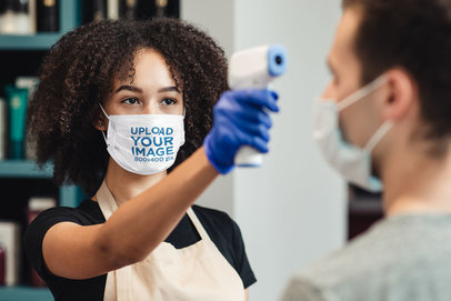Face Mask Mockup of a Young Woman Using a Thermometer 
