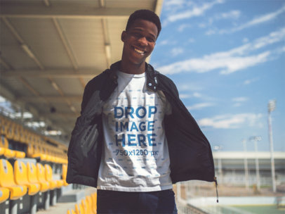 Jovial Young Man Wearing Round Neck Tee and Jacket While Hanging Out at a Stadium Template a14251