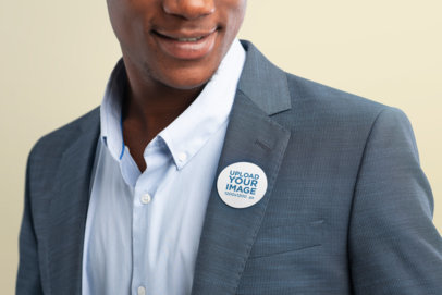 Cropped Face Mockup of a Smiling Man Wearing a Sticker in His Clothes