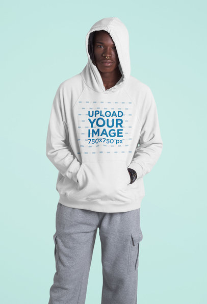 Pullover Hoodie Mockup of a Serious Man Standing in a Studio