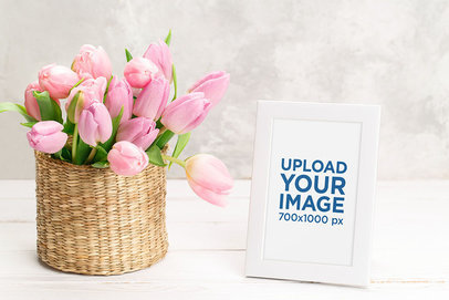 Mockup of a Picture Frame Placed by a Basket Filled With Tulips 36225-r-el2