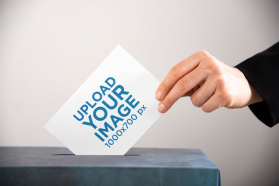 Mockup of a Horizontal Flyer Being Placed Inside a Ballot Box 42255-r-el2
