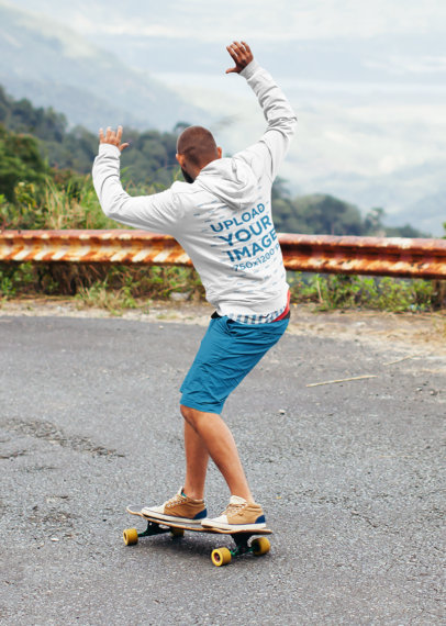 Back-View Hoodie Mockup of a Man Downhill Skateboarding