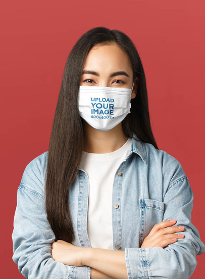 Face Mask Mockup Featuring a Woman Posing With Crossed Arms 