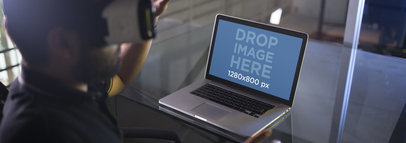 MacBook Mockup Featuring a Man Wearing an Oculus Gear VR Device a14246wide