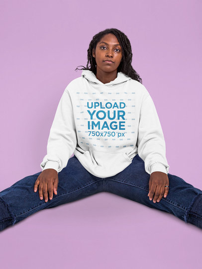 Pullover Hoodie Mockup of a Serious Woman Sitting in a Studio