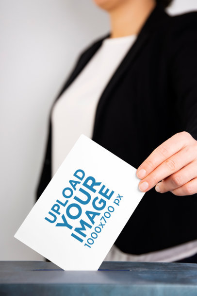 Mockup Featuring a Woman Putting a Horizontal Flyer Into a Polling Box 42254-r-el2