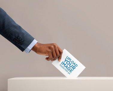 Mockup of a Man Placing a Folded Flyer Inside a Ballot Box