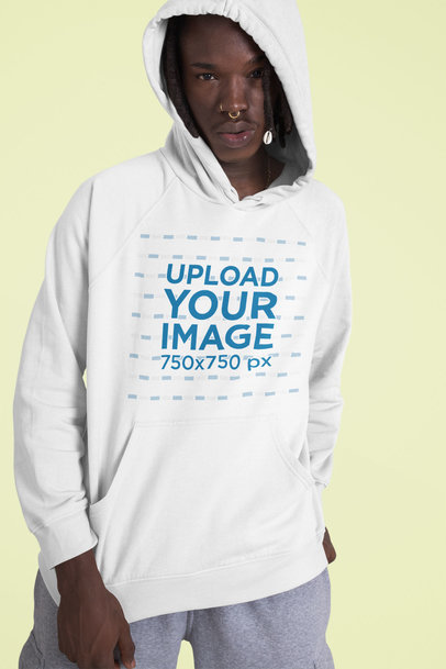 Mockup of a Serious Man Wearing a Customizable Pullover Hoodie 