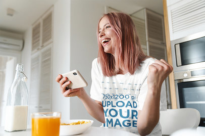 T-Shirt Mockup of a Happy Woman Eating Breakfast