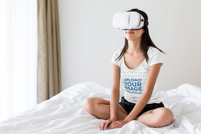 T-Shirt Mockup of a Woman Using a VR Device on Her Bed 42288-r-el2