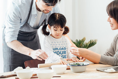 Long-Sleeve Tee Mockup of a Little Girl Baking with Her Parents