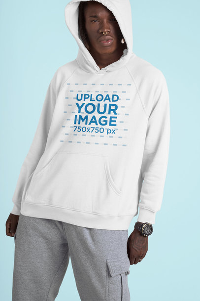 Studio Mockup of a Man Wearing a Hoodie and a Nose Piercing