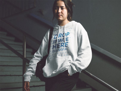 Young Asian Woman Wearing a Heather Pullover Hoodie While Waiting for a Date Template a12694