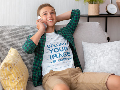 T-Shirt Mockup of a Teenage Boy Chilling at Home