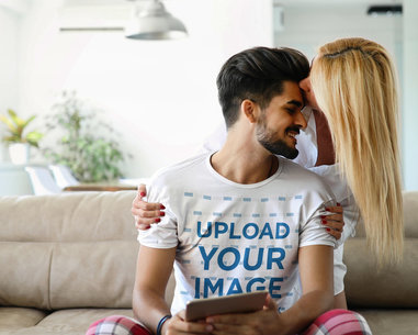 T-Shirt Mockup Featuring a Man with His Girlfriend at Home