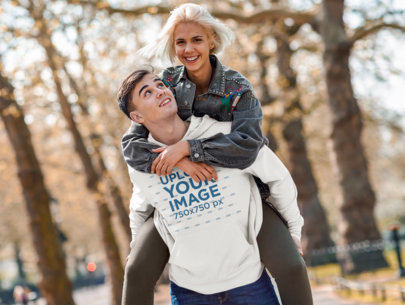 Pullover Hoodie Mockup of a Happy Man Carrying His Girlfriend 
