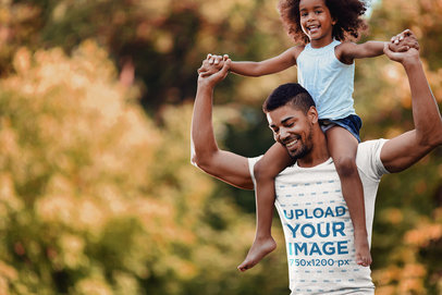 T-Shirt Mockup Featuring a Dad Carrying His Daughter on His Shoulders