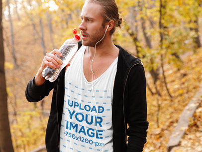 Mockup of a Bearded Man with a Scoop Neck Tank Top Drinking Water in the Woods