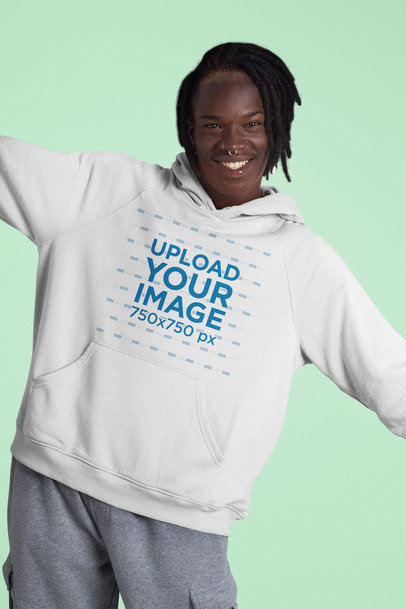 Hoodie Mockup of a Happy Man Posing Against a Plain Color Backdrop 42977