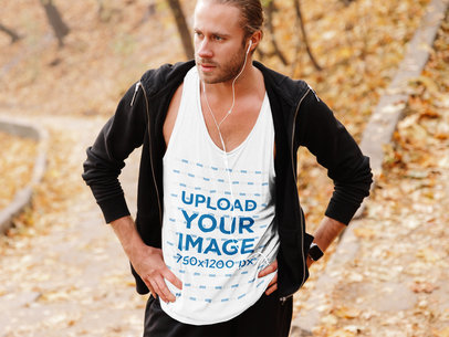 Tank Top Mockup of a Serious Man Standing in the Woods