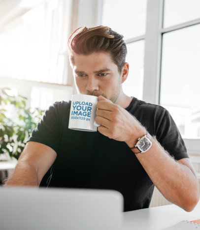 11 oz Coffee Mug Mockup Featuring a Man Working from Home 43550-r-el2