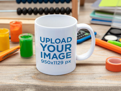Mockup of an 11 oz Coffee Mug Placed on a Kid's Desk