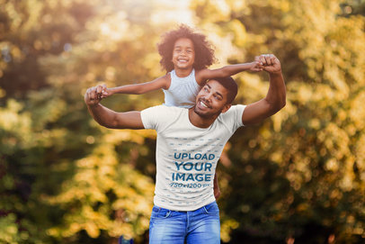 Tee Mockup of a Father Carrying His Daughter on His Back