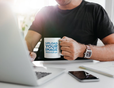 11 oz Mug Mockup Featuring a Man Drinking Coffee While Working From Home 43554-r-el2