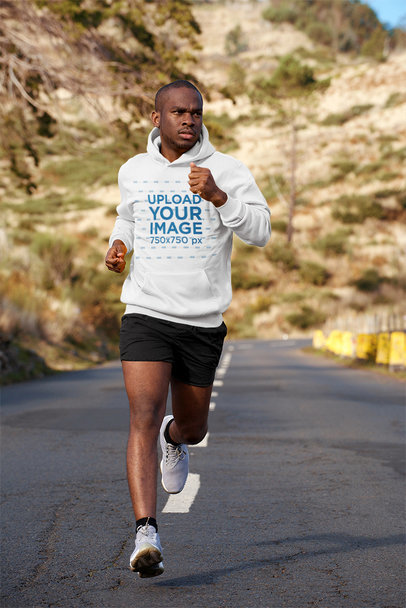 Pullover Hoodie Mockup Featuring a Man Running Outdoors