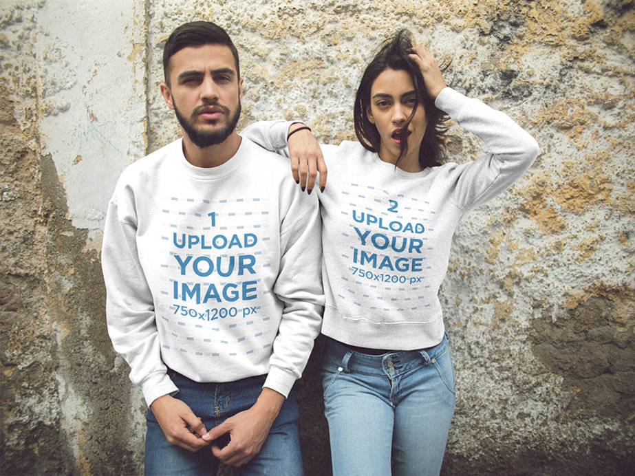 Beautiful Couple Wearing Crewneck Sweatshirts While Lying Against an Old Corner Mockup