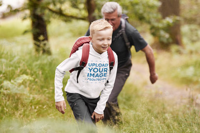 Hoodie Mockup of a Happy Kid Hiking With His Father 
