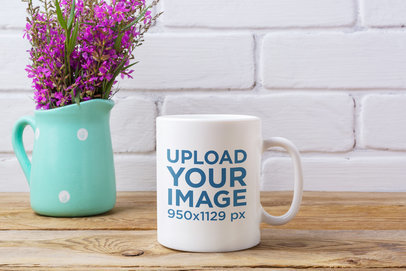 11 oz Mug Mockup Featuring a Rustic Table and a Small Flower Vase 