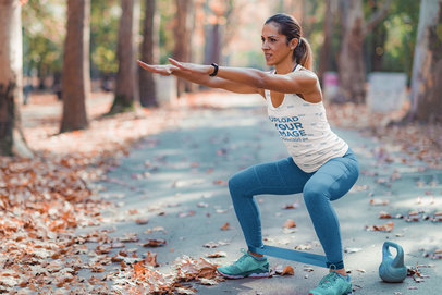 Mockup Featuring a Fitness Woman Wearing a Sublimated Tank Top While Training