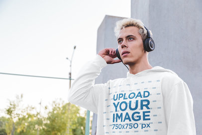 Hoodie Mockup Featuring a Surprised Man Listening to Music 