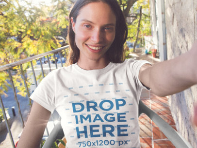 Selfie Template of a Blonde Smiling Woman Wearing a Round Neck Tee While Outdoors