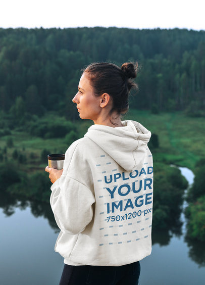 Back-View Hoodie Mockup of a Woman Admiring the Landscape