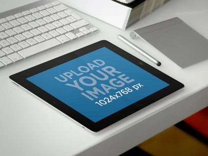 Mockup of an iPad in Landscape Position over a Clear Desk
