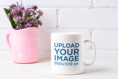 Mockup of an 11 oz Coffee Mug Next to a Pink Ornament 43568-r-el2
