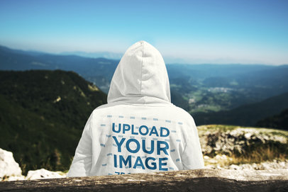 Back View Hoodie Mockup Featuring a Man Admiring the Mountains 