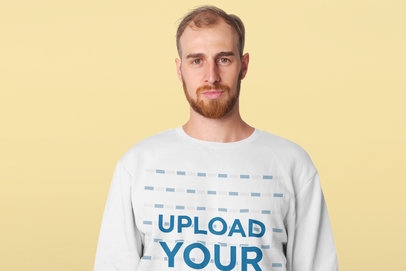 Crewneck Sweatshirt Mockup Featuring a Serious Man in a Studio