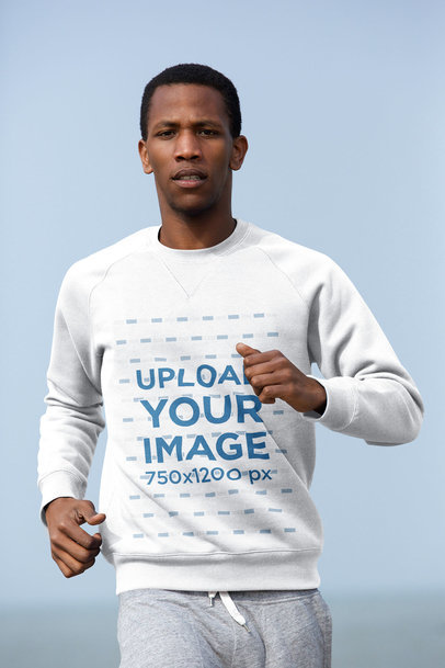 Mockup of a Man Wearing a Sweatshirt While Jogging