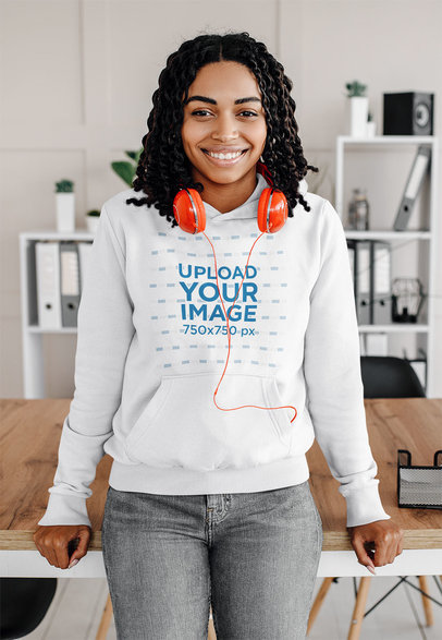 Mockup of a Young Woman with Curly Hair Wearing a Hoodie at Home 