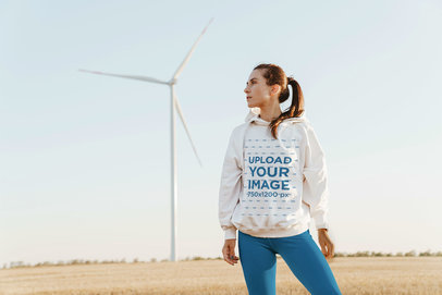 Hoodie Mockup Featuring a Woman and a Wind Turbine in the Background 42805-r-el2